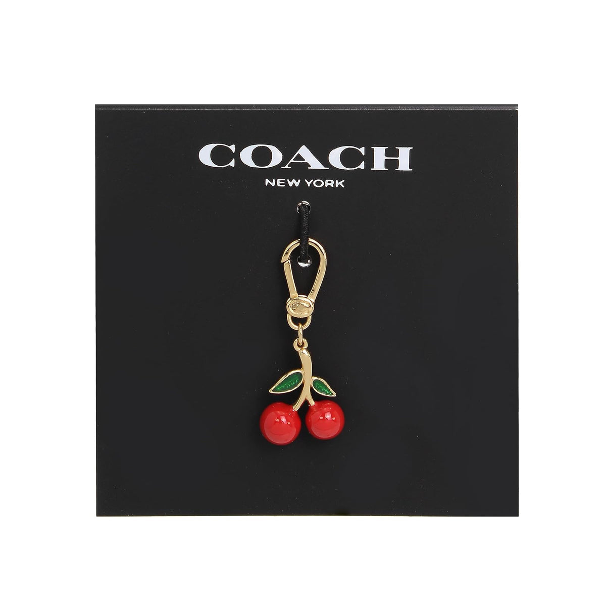 COACH - Abalorio de cereza coleccionable