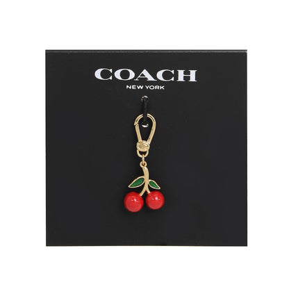COACH - Abalorio de cereza coleccionable