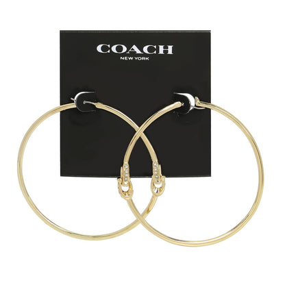COACH - arete de corazón esmaltado