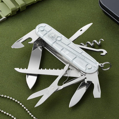 Victorinox Navaja Huntsman Silver Tech, Plata Transparente, 15 Usos | Navaja resistente con tijeras y sierra para madera para camping y exterior. Incluye cuchilla y sacacorchos. Fabricado en Suiz