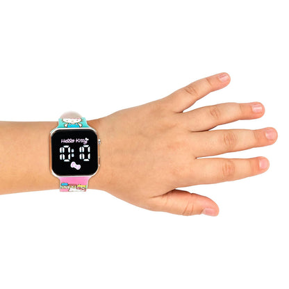 Accutime Hello Kitty - Reloj LED para niños, caja de plástico plateado, ilustraciones coloridas impresas, visualización LED blanca, correa de silicona suave, fácil de leer, ideal para niñas, mercancía