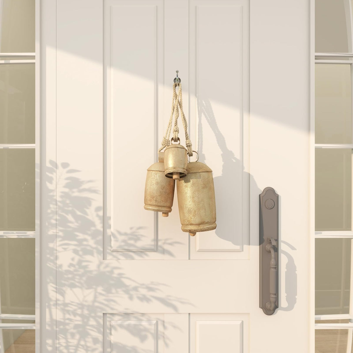 Deco 79 - Campana Decorativa de Vaca con Cuerda Colgante de Yute, de Metal Inspirado en Tibetano, Juego de 3 10 Pulgadas, 8 Pulgadas, 6 Pulgadas de Alto, Dorado