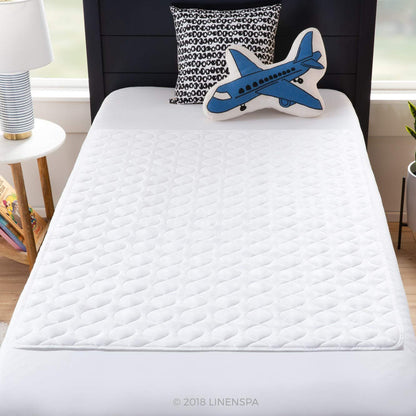 Linenspa - Protector de Sábanas y Colchón 100% Impermeable - Antiderrapante y Altamente Absorbente - Lavable a Máquina - Acolchado y Suave - 86 x 132 cm
