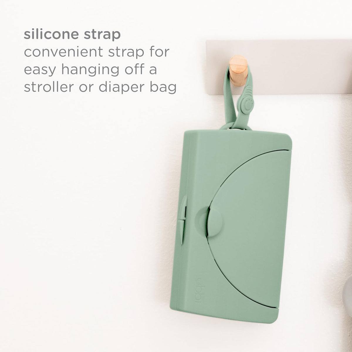 Ubbi On-The-Go - Dispensador de toallitas para bebé, contenedor portátil para viajes, accesorio imprescindible para recién nacidos, soporte para toallitas reutilizables, color verde salvia