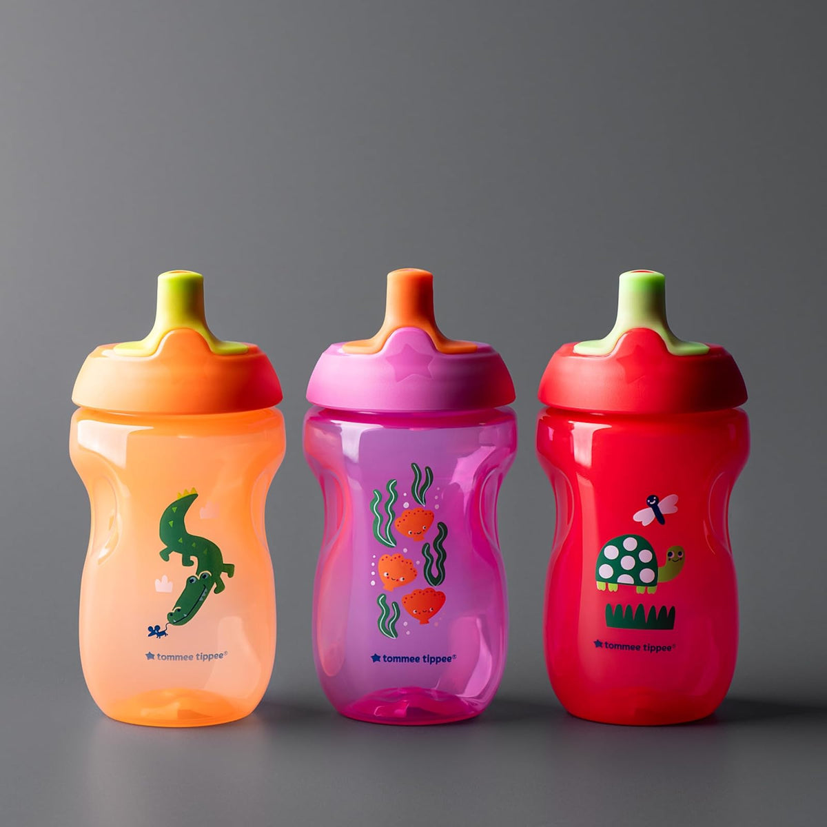 Tommee Tippee Vaso Entrenador Sporty, 1-3 Años, Antiderrames, 295ml | Paquete de 3, Boquilla Resistente a Mordidas, Fácil de Sujetar, Rosa, Rojo y Naranja, Libre de BPA