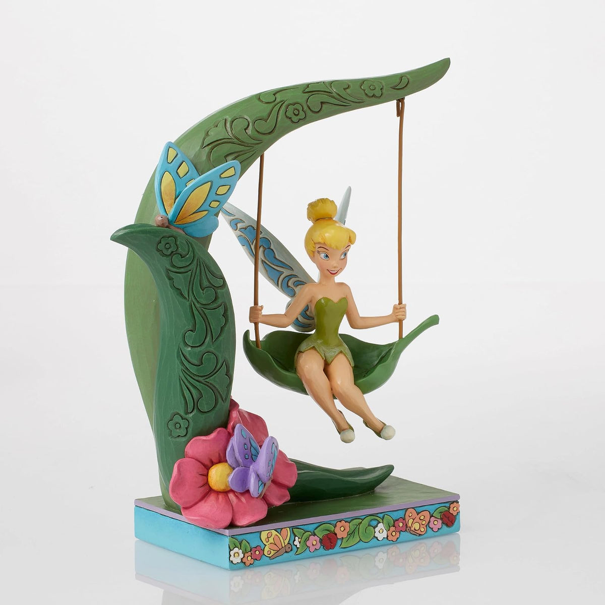 Enesco Disney Traditions Collection by Jim Shore Peter Pan Tinker Bell Spring Swing Figurita de resina de piedra pintada a mano coleccionable Disney Tink Figurines para decoración del hogar, 8.63