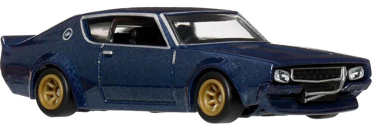 Hot Wheels Collector Cultura Automotriz Nissan Skyline 2GT-R, Auto 1:64 Metal/Metal y Real Riders, para colección y exhibición, 3 años en adelante