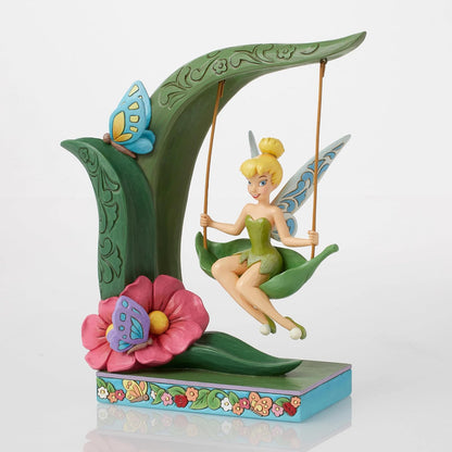 Enesco Disney Traditions Collection by Jim Shore Peter Pan Tinker Bell Spring Swing Figurita de resina de piedra pintada a mano coleccionable Disney Tink Figurines para decoración del hogar, 8.63