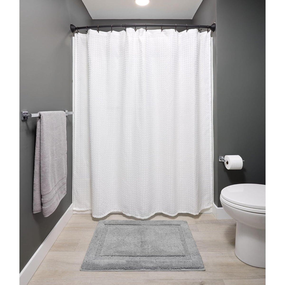 interDesign 79077 Wall Mounted Curved Bathroom Shower Curtain Rod Hardware Included, Adjustable, Matte Black, 41” x 72”