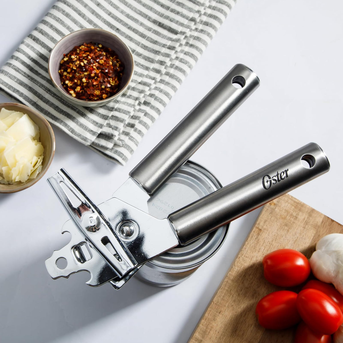 Oster Baldwyn - Abrelatas y abrebotellas multifunción con mango de acero inoxidable, herramienta de cocina duradera para una fácil apertura