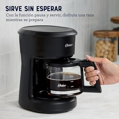 Oster Cafetera, de 5 Tazas de Capacidad, con Filtro Reutilizable, Botón con Luz de Encendido y Apagado, Función Pausa y Servir, Ventanilla de Agua, Jarra con Medidas, Color Negro,