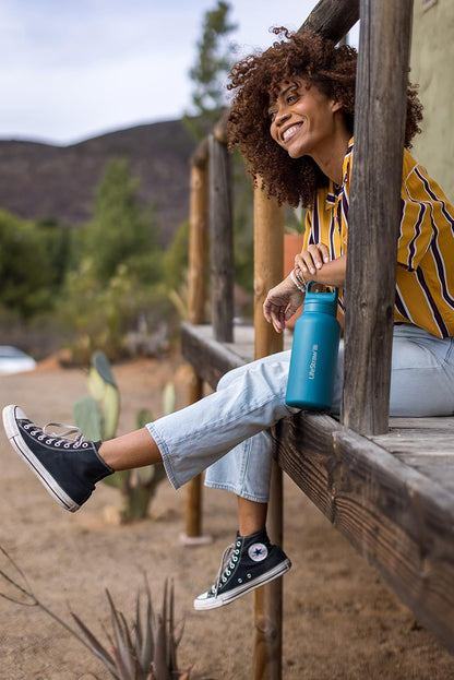 LifeStraw Go Series - Botella de filtro de agua de acero inoxidable aislada para viajes y uso diario, elimina bacterias, parásitos y microplásticos, mejora el sabor, 1 L azul islandés