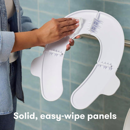 Frida - Asiento portátil plegable para inodoro para bebé, asiento plegable para orinal de viaje para niños pequeños, se adapta a inodoros redondos y ovalados, base antideslizante, asas, incluye bolsa