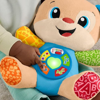 Fisher-Price Ríe y Aprende Perrito Aprende Conmigo 6+ Meses | Peluche musical; 5 botones, corazón iluminado y más de 80 canciones en español e inglés