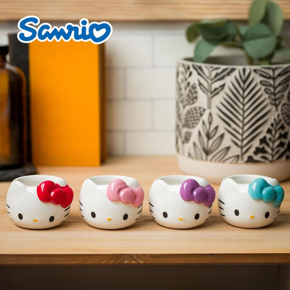 Silver Buffalo Sanrio Hello Kitty - Juego de 4 lazos de cerámica esculpida 3D con diseño de Hello Kitty (4 unidades), perfecto como juego de azúcar, crema o leche, 3.5 onzas
