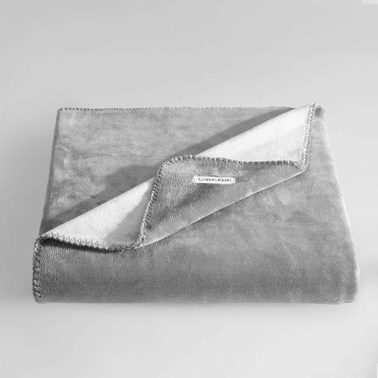 Calvin Klein - Manta Reversible de Felpa de Alta Calidad con Detalles de Punto de azotea, práctica Ropa de Cama de Lujo (Moderno Reversible Gris sólido, 50 x 70)