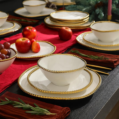 Christian Siriano Akoya - Juego de vajilla de porcelana, 12 piezas, juego de platos para 4, platos y cuencos, blanco y dorado