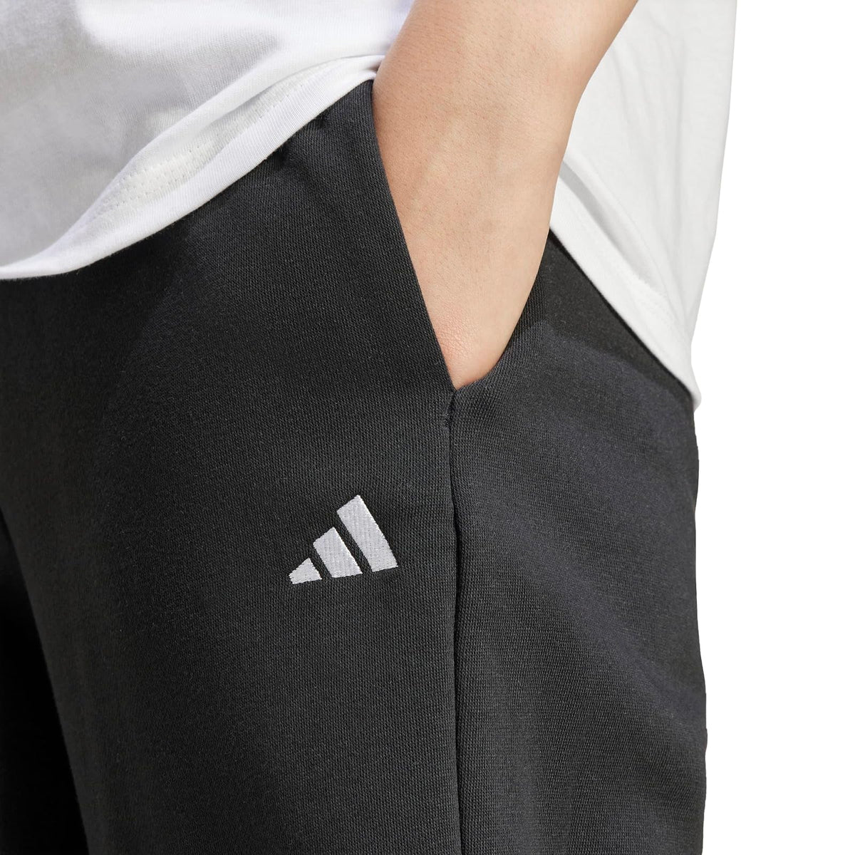 adidas Pantalones deportivos de forro polar con logotipo pequeño para mujer