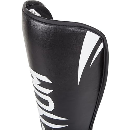 Venum Challenger, detalle de espinilla Negro/Blanco
